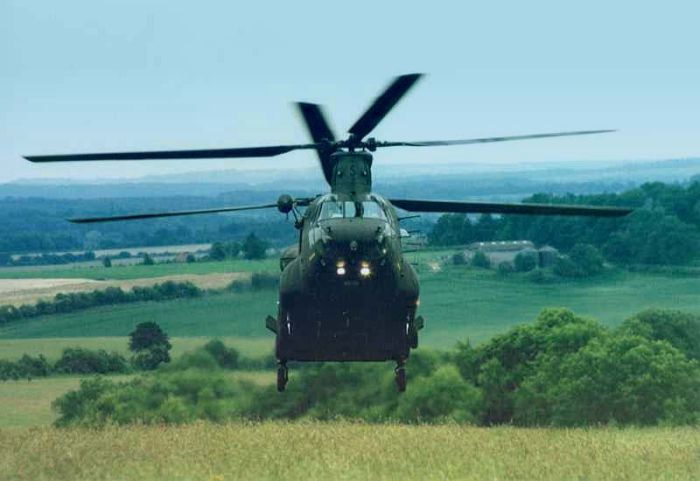 Somewhere in England, A Boeing Chinook stands guard.