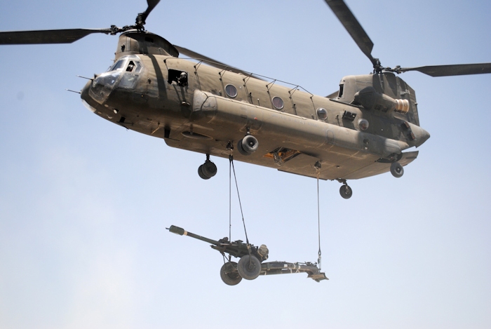 31 May 2011: A CH-47D Chinook helicopter carries an M119 howitzer to Soldiers of Battery A, 1st Battalion, 6th Field Artillery Regiment, 3rd Brigade Combat Team, 1st Infantry Division, Task Force Duke, at their mountain outpost in Khowst province, Afghanistan.