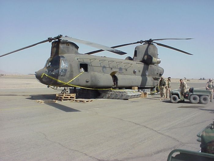 An unknown Chinook sitting on pallets in the Middle Eastern Theater, circa 2001.