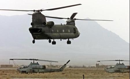 A U.S. CH-47D Chinook helicopter takes off from Bagram Air Base in search of the Taliban.
